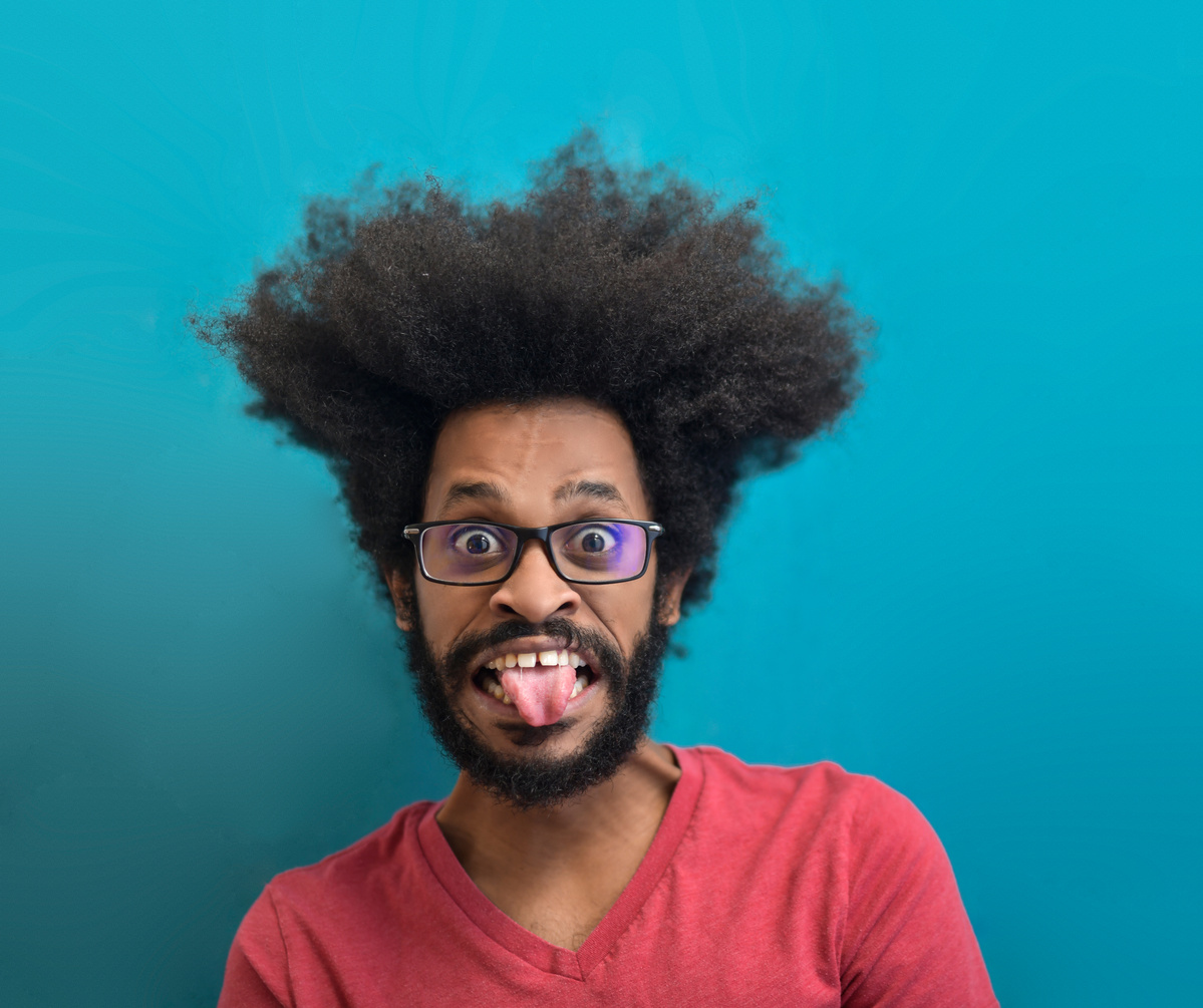 Man In Red Crew Neck Shirt Wearing Black Framed Eyeglasses